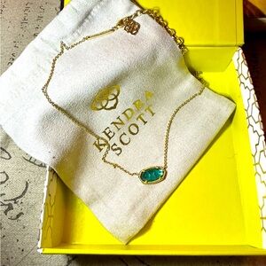 Kendra Scott necklace. Stone color is emerald.